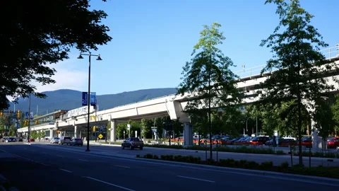 Modern Automated Rapid Transit SkyTrain Moving on Elevated Rail in Vancouve.. 스톡 동영상 338057028