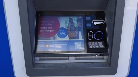 Modern automated teller machine (ATM) interface showing a digital display with 库存影片 333874486