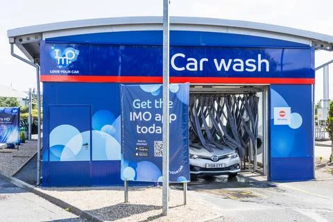 Modern Automatic Car Wash Building with Vehicle Entering. London, UK, 27 July Stock Photos
