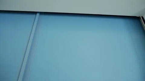 Modern automatic garage door lowering process with steel panels Video stock 313534058