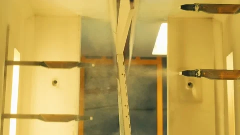 Modern automatic machine hand spray working with painting parts in factory Stock Footage 201593478