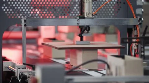 Modern automatic machine line of cardboard box. Conveyor line for the production Stock Photos
