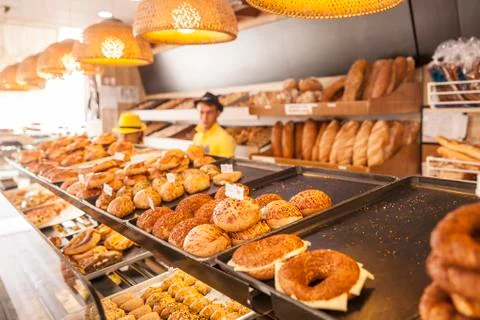 Modern bakery with different kinds of bread, cakes and buns ( selective focus ) Stock Photos