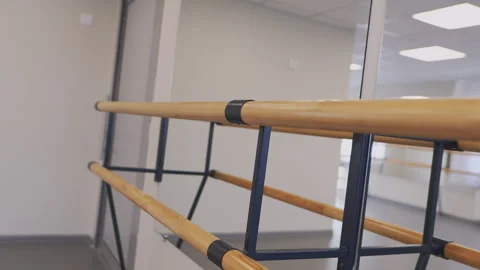 Modern ballet class equipped with ballet bar and mirror Stock Footage 293311072