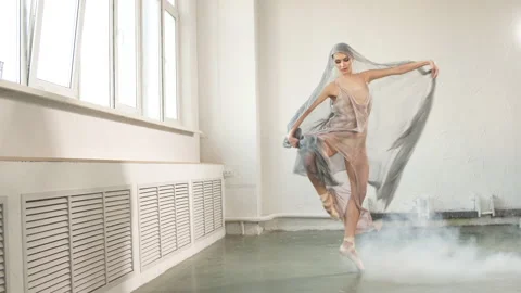 Modern ballet dancer in scenic flowing costume working out at studio Stock Footage 107699609