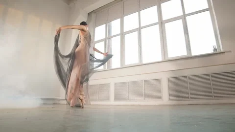 Modern ballet dancer in scenic flowing costume working out at studio, slow Stock Footage 107701150