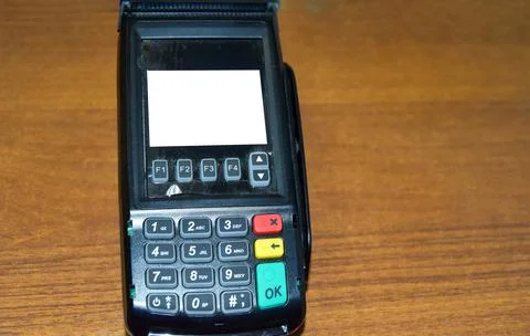 A modern bank payment terminal for processing credit card payments. Equaring Stock Photos