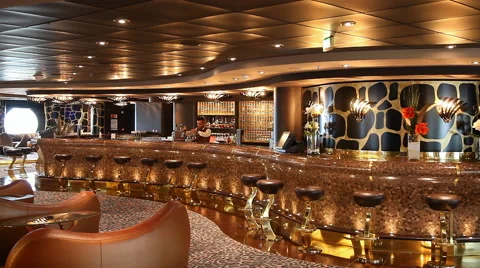 Modern bar with bottles at background and young male bartender Stock Footage 64660106