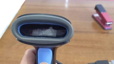 A modern bar code scanner for commerce. Working with the scanner. Stock Footage 202175151