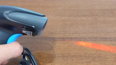 A modern bar code scanner for commerce. Working with the scanner. Stock Footage 202175160