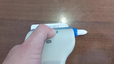 A modern bar code scanner for commerce. Working with the scanner. Stock Footage 202175210