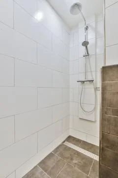 Modern bathroom with dark floor Stock Photos
