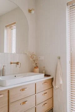 Modern bathroom features a unique vanity with contemporary designs and decor ele Stock Photos