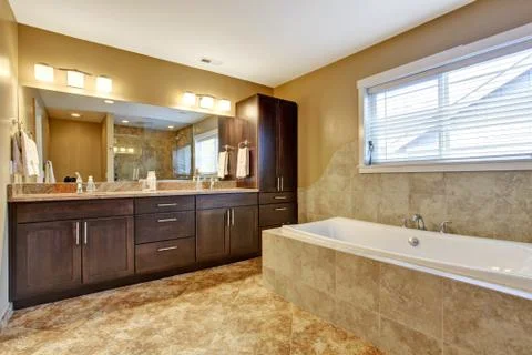 Modern bathroom interior with dark brown cabinets Stock Photos