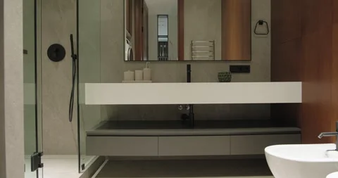 Modern bathroom interior design with sink faucet mirror wooden cabinet washing Stock Footage 277551116