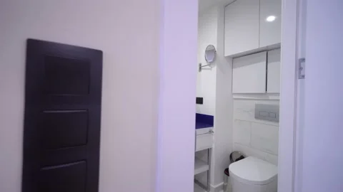 Modern bathroom with light white dressing table, mirror frame and accessories. Stock Footage 171595751