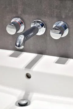 Modern bathroom taps Stock Photos