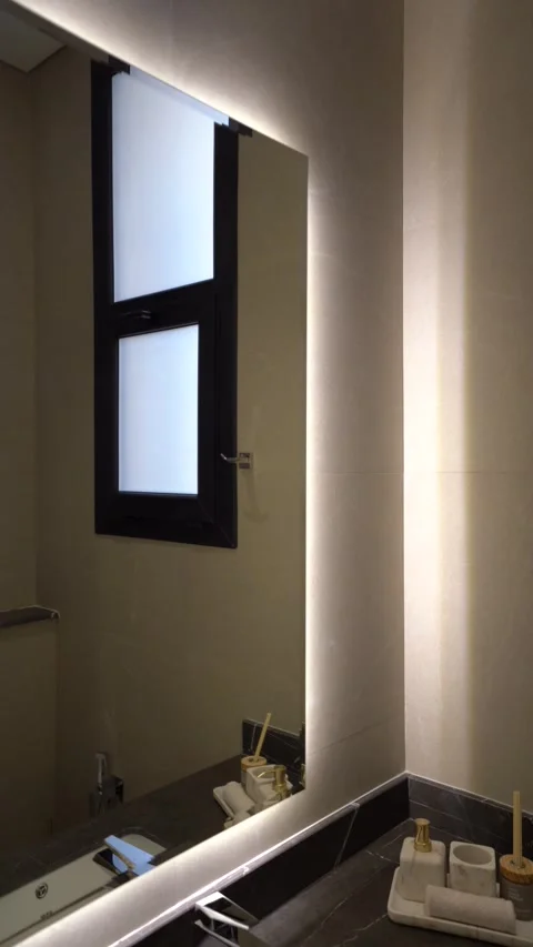 Modern Bathroom Vanity with LED Backlit Mirror and Dark Marble Counter Stock Footage 336418632