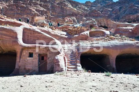 Modern bedouin house in ancient cave in petra Stock Photos
