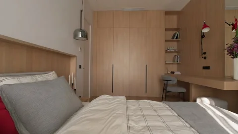 Modern bedroom with built-in wardrobe working space bed Stock Footage 299638637