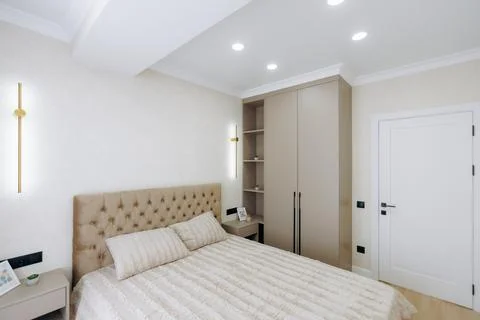 A Modern Bedroom Featuring an Elegant Bed Design with a Beautiful and Minimalist Stock Photos