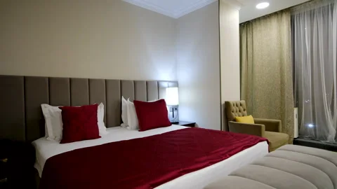 Modern Bedroom Interior and bed with many pillows Vidéo 306998126