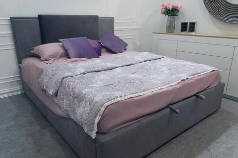 Modern bedroom with pillows on bed. Interior Stock Photos