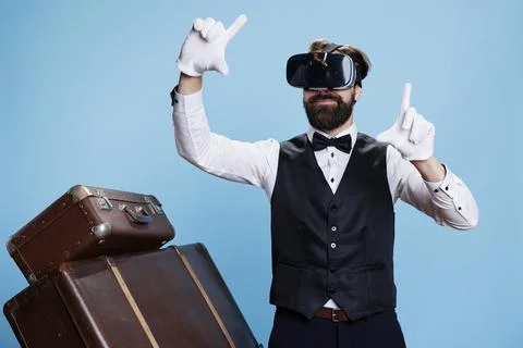 Modern bellboy using vr glasses Stock Photos