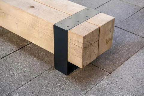 Modern bench made of large block of wood Foto stock