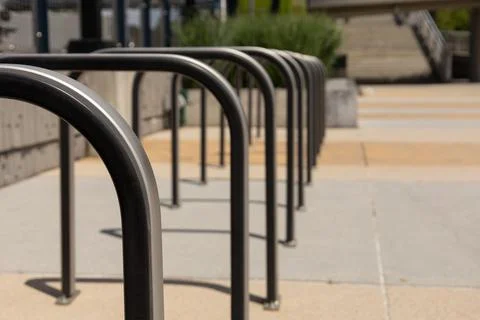 Modern Bicycle Racks With Repeating Pattern At Transit Station Stock Photos
