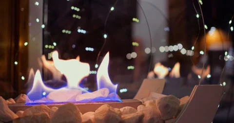 Modern biofire with soft blue flames creates cozy atmosphere, adding eco Stock Footage 300790845
