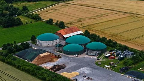 Modern Biogas Facility with Digesters and Agricultural Biomass Stock Photos