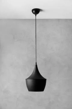 Modern black chandelier on a gray background Stock Photos