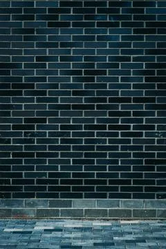 Modern black colored brick pattern wall texture grunge background 스톡 사진