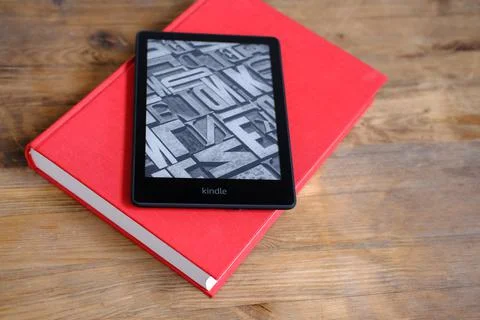 Modern black e-book reader, digital book Kindle, tablet computer device for d Stock Photos