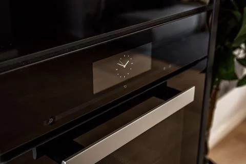 Modern black oven with timer Stock Photos