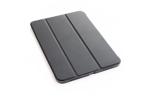 Modern black tablet computer in protective case isolated on white Stock Photos