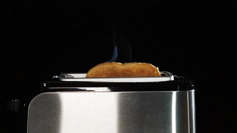 Modern black toaster with a bread. Stock Footage 122497214