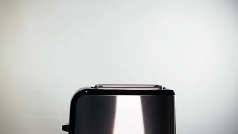 Modern black toaster with a bread. Stock Footage 127409642
