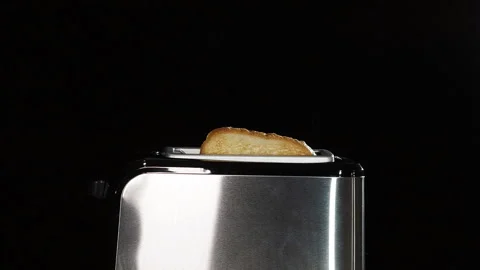 Modern black toaster with a bread. Stock Footage 130425939