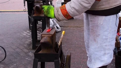 Modern blacksmith in capital demonstrates their ability to manufacture fasteners Stock Footage 71067449