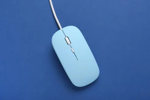 Modern blue computer mouse on color background Stock Photos