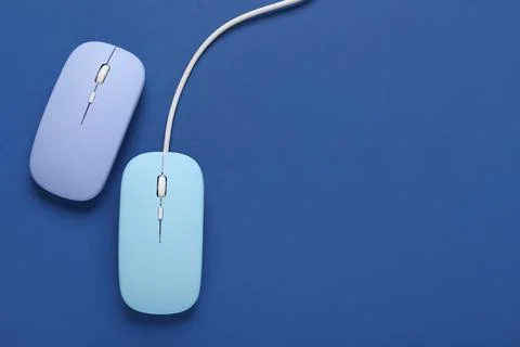Modern blue computer mouse devices on color background Stock Photos