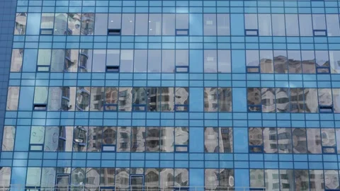 Modern blue glass building facade reflecting Stock Footage 332432428