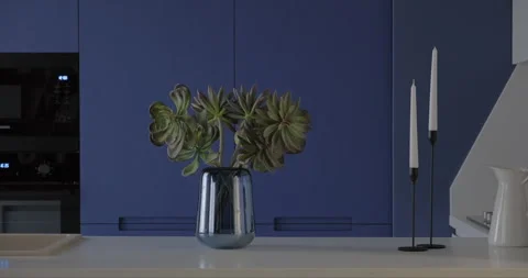 Modern blue kitchen interior design with build-in cabinet stone island sink Stock Footage 275721586