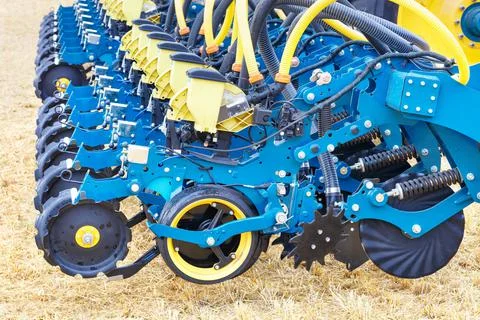 Modern blue multi-row seeder used in the agricultural sector. Stock Photos
