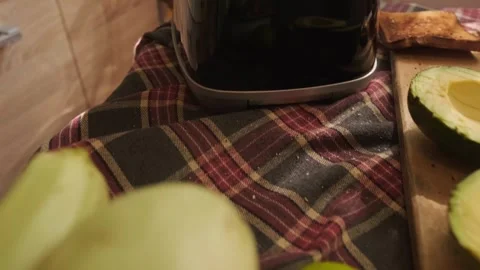 Modern breakfast on the kitchen table crispy toasts avocado and fresh seasonal Stock Footage 311864993