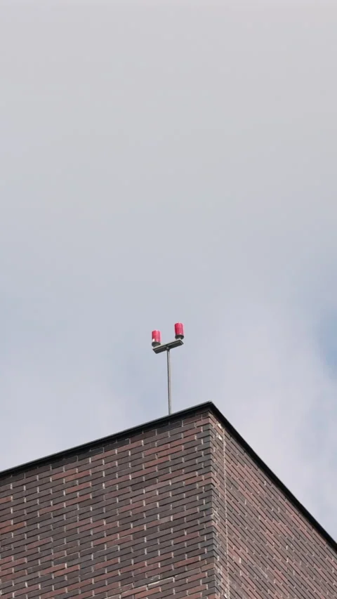 Modern brick building corner against blue sky. Vertical 動画素材 332066870