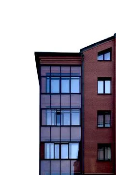 Modern brick building facade with large glass windows isolated on white. Mi.. Stock Photos