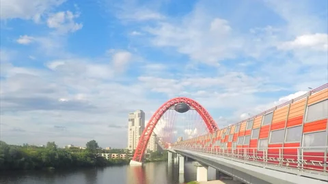 Modern bridge across the river on summer day timelapse 스톡 동영상 87207914